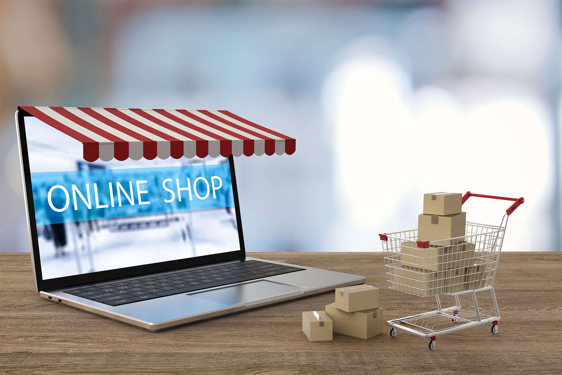Laptop with shop awning over screen and 'Online Shop' showing on screen